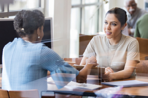 Two women engaged in conversation.