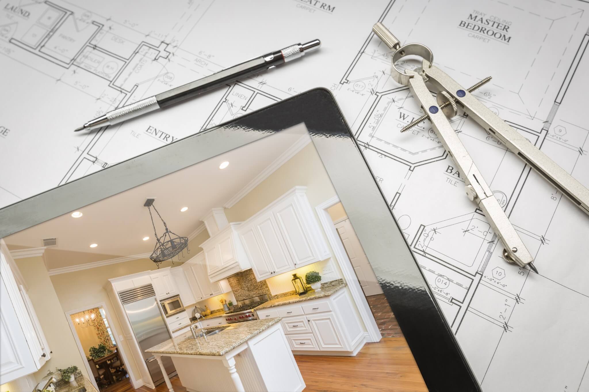 A tablet computer displaying images of a modern kitchen.