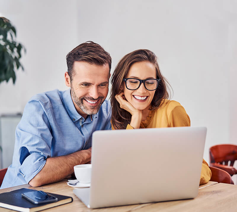 happy-couple-using-laptop-video-chat-2