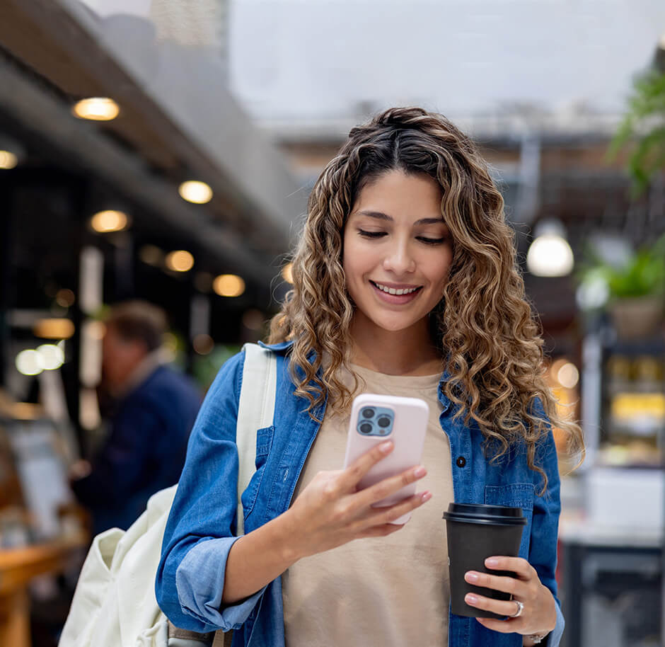 happy-woman-using-mobile-to-check-rates