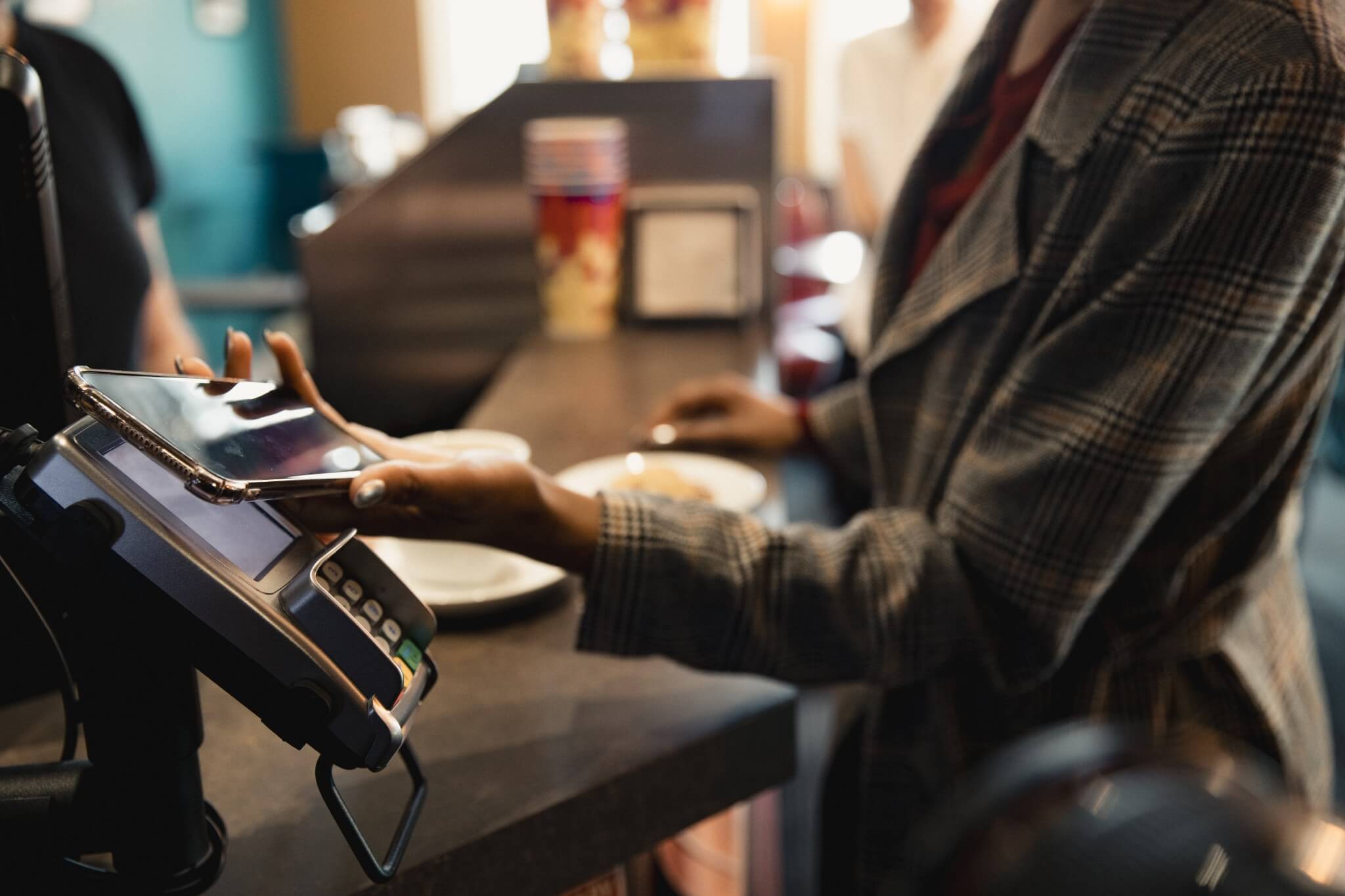 A woman making a mobile payment.