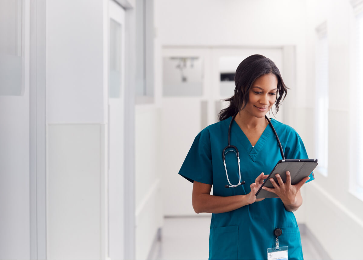 Nurse looking at her Smartphone.